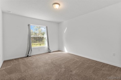 Escape to privacy and space with this 2017-built 3 bedroom, 2 on Pine Ridge Community Golf and Country Club in Florida - for sale on GolfHomes.com, golf home, golf lot
