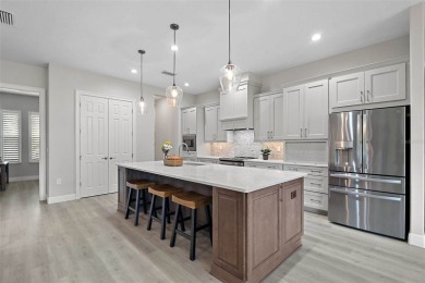 Come discover this stunning residence situated in Harbor Hills on Harbor Hills Country Club in Florida - for sale on GolfHomes.com, golf home, golf lot