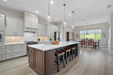 Come discover this stunning residence situated in Harbor Hills on Harbor Hills Country Club in Florida - for sale on GolfHomes.com, golf home, golf lot