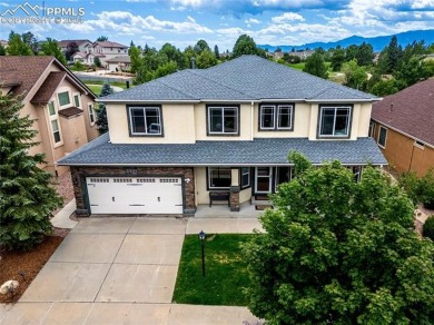 This beautiful home overlooking Pine Creek Golf Course is on Pine Creek Golf Club in Colorado - for sale on GolfHomes.com, golf home, golf lot