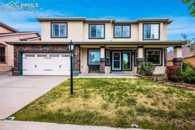 This beautiful home overlooking Pine Creek Golf Course is on Pine Creek Golf Club in Colorado - for sale on GolfHomes.com, golf home, golf lot