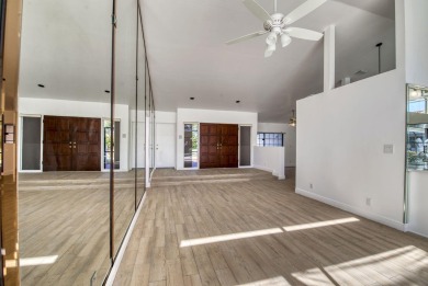 This extremely bright and expansive lakefront home in Greenview on Greenview Cove Golf Club in Florida - for sale on GolfHomes.com, golf home, golf lot