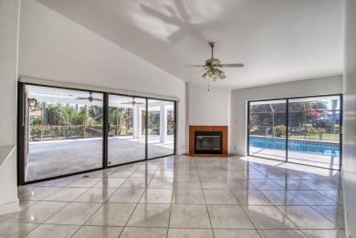 This extremely bright and expansive lakefront home in Greenview on Greenview Cove Golf Club in Florida - for sale on GolfHomes.com, golf home, golf lot