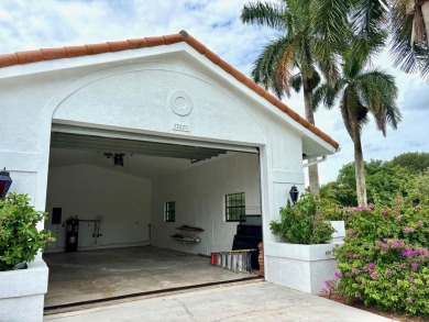 This extremely bright and expansive lakefront home in Greenview on Greenview Cove Golf Club in Florida - for sale on GolfHomes.com, golf home, golf lot