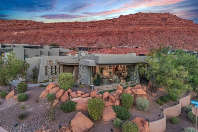 Stunning views and walls of glass bring the red rocks and on Entrada at Snow Canyon in Utah - for sale on GolfHomes.com, golf home, golf lot