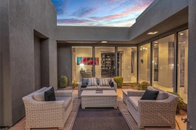 Stunning views and walls of glass bring the red rocks and on Entrada at Snow Canyon in Utah - for sale on GolfHomes.com, golf home, golf lot