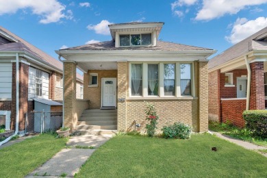 Charming brick bungalow offering 3 bedrooms, 1 full bath, a on Marquette Park Golf Course in Illinois - for sale on GolfHomes.com, golf home, golf lot