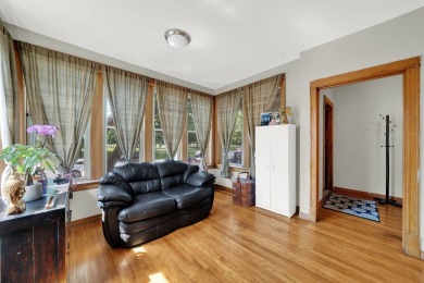 Charming brick bungalow offering 3 bedrooms, 1 full bath, a on Marquette Park Golf Course in Illinois - for sale on GolfHomes.com, golf home, golf lot