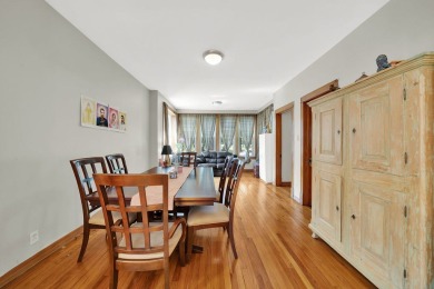 Charming brick bungalow offering 3 bedrooms, 1 full bath, a on Marquette Park Golf Course in Illinois - for sale on GolfHomes.com, golf home, golf lot