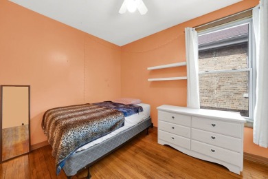 Charming brick bungalow offering 3 bedrooms, 1 full bath, a on Marquette Park Golf Course in Illinois - for sale on GolfHomes.com, golf home, golf lot