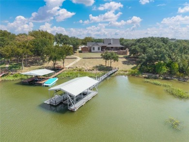 Welcome to your dream getaway! This breathtaking lakefront home on Hideout Golf Club and Resort  in Texas - for sale on GolfHomes.com, golf home, golf lot