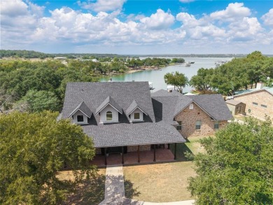 Welcome to your dream getaway! This breathtaking lakefront home on Hideout Golf Club and Resort  in Texas - for sale on GolfHomes.com, golf home, golf lot