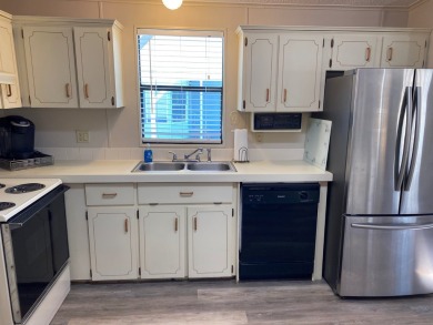 Cozy Open Concept mobile home in vibrant 55+ community on leased on Spanish Lakes Fairways in Florida - for sale on GolfHomes.com, golf home, golf lot