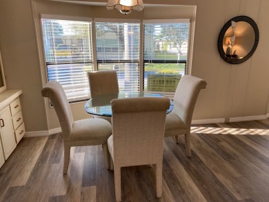 Cozy Open Concept mobile home in vibrant 55+ community on leased on Spanish Lakes Fairways in Florida - for sale on GolfHomes.com, golf home, golf lot