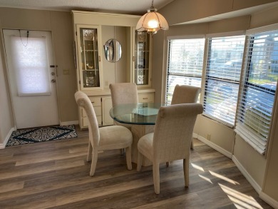 Cozy Open Concept mobile home in vibrant 55+ community on leased on Spanish Lakes Fairways in Florida - for sale on GolfHomes.com, golf home, golf lot