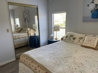 Cozy Open Concept mobile home in vibrant 55+ community on leased on Spanish Lakes Fairways in Florida - for sale on GolfHomes.com, golf home, golf lot