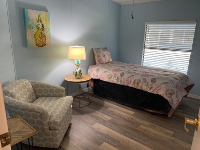 Cozy Open Concept mobile home in vibrant 55+ community on leased on Spanish Lakes Fairways in Florida - for sale on GolfHomes.com, golf home, golf lot