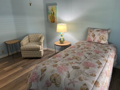 Cozy Open Concept mobile home in vibrant 55+ community on leased on Spanish Lakes Fairways in Florida - for sale on GolfHomes.com, golf home, golf lot