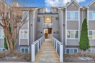Enjoy effortless lake living in this top-floor 2-bedroom, 2-bath on The Waterfront Country Club in Virginia - for sale on GolfHomes.com, golf home, golf lot