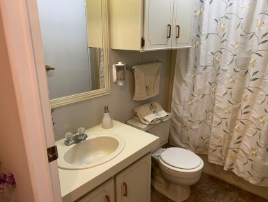 Cozy Open Concept mobile home in vibrant 55+ community on leased on Spanish Lakes Fairways in Florida - for sale on GolfHomes.com, golf home, golf lot