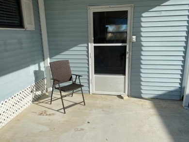 Cozy Open Concept mobile home in vibrant 55+ community on leased on Spanish Lakes Fairways in Florida - for sale on GolfHomes.com, golf home, golf lot