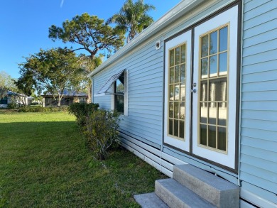 Cozy Open Concept mobile home in vibrant 55+ community on leased on Spanish Lakes Fairways in Florida - for sale on GolfHomes.com, golf home, golf lot