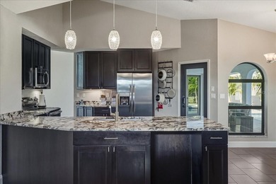 NOT IN A FLOOD ZONE! Metal roof, impact windows and sliders, new on Seminole Lakes Country Club in Florida - for sale on GolfHomes.com, golf home, golf lot