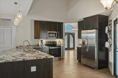 NOT IN A FLOOD ZONE! Metal roof, impact windows and sliders, new on Seminole Lakes Country Club in Florida - for sale on GolfHomes.com, golf home, golf lot