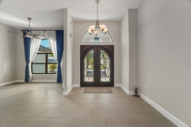 NOT IN A FLOOD ZONE! Metal roof, impact windows and sliders, new on Seminole Lakes Country Club in Florida - for sale on GolfHomes.com, golf home, golf lot