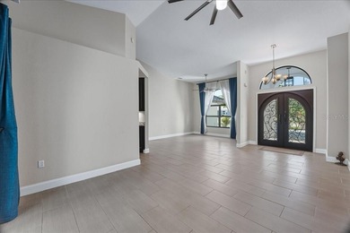 NOT IN A FLOOD ZONE! Metal roof, impact windows and sliders, new on Seminole Lakes Country Club in Florida - for sale on GolfHomes.com, golf home, golf lot