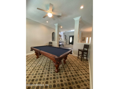 Large 2-story mostly brick home in serene Hidden Hills. Situated on Hidden Hills Country Club in Florida - for sale on GolfHomes.com, golf home, golf lot