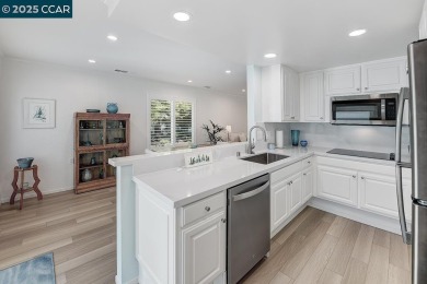 Step into this sophisticated level-in, single row and end unit on Rossmoor Golf Course in California - for sale on GolfHomes.com, golf home, golf lot