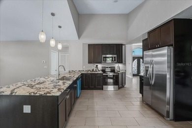 NOT IN A FLOOD ZONE! Metal roof, impact windows and sliders, new on Seminole Lakes Country Club in Florida - for sale on GolfHomes.com, golf home, golf lot