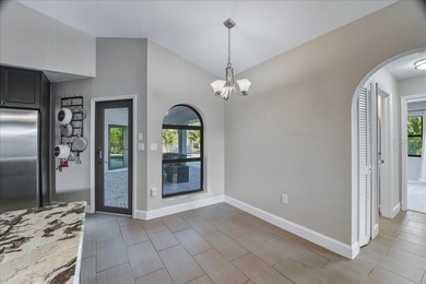 NOT IN A FLOOD ZONE! Metal roof, impact windows and sliders, new on Seminole Lakes Country Club in Florida - for sale on GolfHomes.com, golf home, golf lot