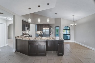 NOT IN A FLOOD ZONE! Metal roof, impact windows and sliders, new on Seminole Lakes Country Club in Florida - for sale on GolfHomes.com, golf home, golf lot