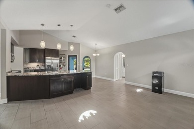 NOT IN A FLOOD ZONE! Metal roof, impact windows and sliders, new on Seminole Lakes Country Club in Florida - for sale on GolfHomes.com, golf home, golf lot