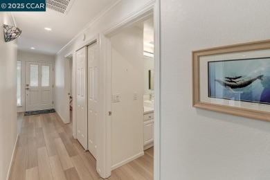 Step into this sophisticated level-in, single row and end unit on Rossmoor Golf Course in California - for sale on GolfHomes.com, golf home, golf lot