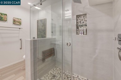 Step into this sophisticated level-in, single row and end unit on Rossmoor Golf Course in California - for sale on GolfHomes.com, golf home, golf lot