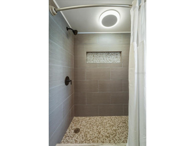 NOT IN A FLOOD ZONE! Metal roof, impact windows and sliders, new on Seminole Lakes Country Club in Florida - for sale on GolfHomes.com, golf home, golf lot