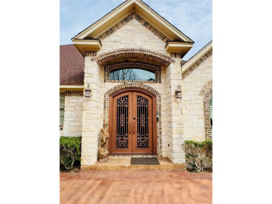 This stunning home is inside a secured gated community that is on White Bluff Resort - Old Course in Texas - for sale on GolfHomes.com, golf home, golf lot