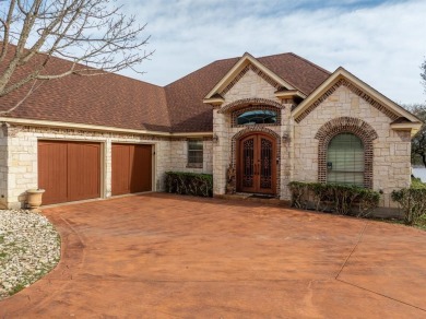 This stunning home is inside a secured gated community that is on White Bluff Resort - Old Course in Texas - for sale on GolfHomes.com, golf home, golf lot