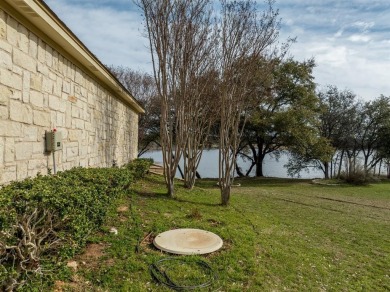 This stunning home is inside a secured gated community that is on White Bluff Resort - Old Course in Texas - for sale on GolfHomes.com, golf home, golf lot