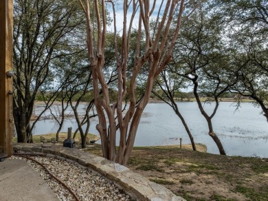 This stunning home is inside a secured gated community that is on White Bluff Resort - Old Course in Texas - for sale on GolfHomes.com, golf home, golf lot