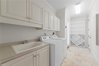 Experience timeless elegance and panoramic water views at 780 on Bentley Village Golf Course in Florida - for sale on GolfHomes.com, golf home, golf lot