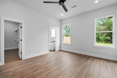 Welcome to East Village! This thoughtfully designed 3-bedroom, 2 on Vache-Grasse Country Club in Arkansas - for sale on GolfHomes.com, golf home, golf lot