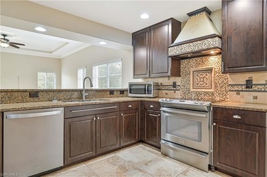 STUNNING, SPACIOUS 2ND-FLOOR END UNIT BOASTING NEARLY 2,000 on Gateway Golf and Country Club in Florida - for sale on GolfHomes.com, golf home, golf lot
