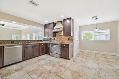 STUNNING, SPACIOUS 2ND-FLOOR END UNIT BOASTING NEARLY 2,000 on Gateway Golf and Country Club in Florida - for sale on GolfHomes.com, golf home, golf lot