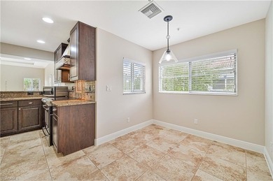 STUNNING, SPACIOUS 2ND-FLOOR END UNIT BOASTING NEARLY 2,000 on Gateway Golf and Country Club in Florida - for sale on GolfHomes.com, golf home, golf lot