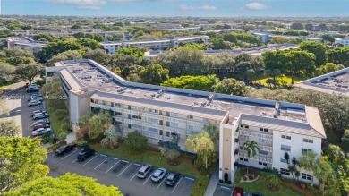 Welcome home to this desirable ground floor condo in one of the on Wynmoor Golf Course in Florida - for sale on GolfHomes.com, golf home, golf lot
