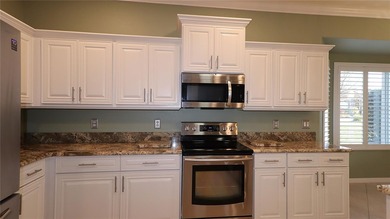 This home shows like a model.  Change in plans and the sellers on Eagle Ridge At Spruce Creek Country Club in Florida - for sale on GolfHomes.com, golf home, golf lot